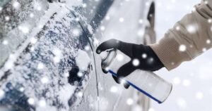 Locksmith using spray de-icer.